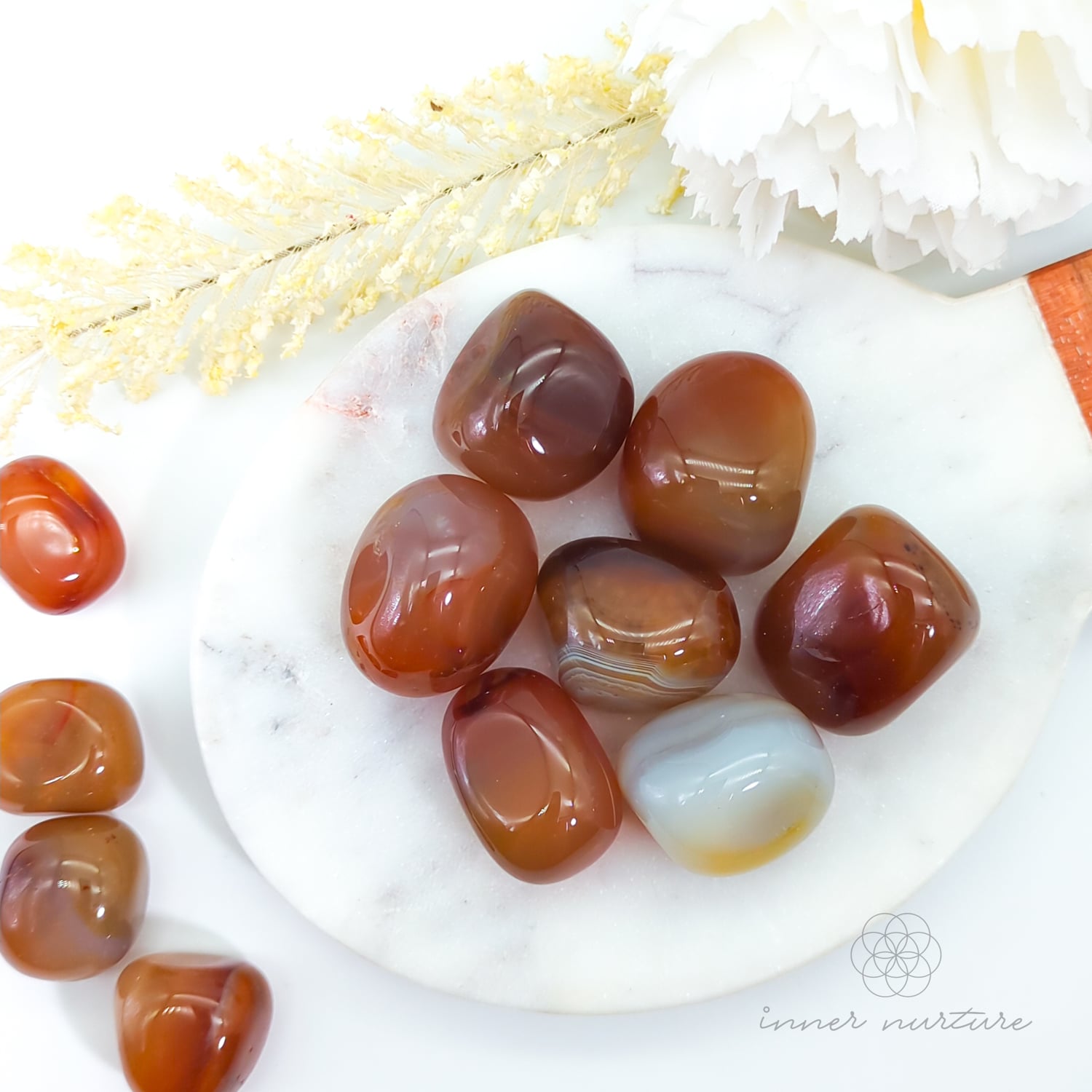 carnelian tumbles on plate - blog post meaning, properties, uses - inner nurture crystal shop australia