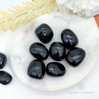 Shop our Black Tourmaline tumble crystal, a grounding stone for protection, clarity, calm, balance, and energetic support.