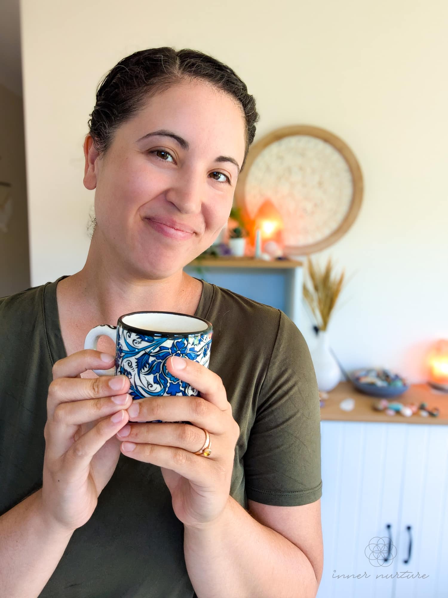 Danielle Turk - with tea - contact us - inner nurture crystals and reiki